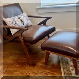 F22. Cavett Leather wood frame accent chair and ottoman from Crate & Barrel. 